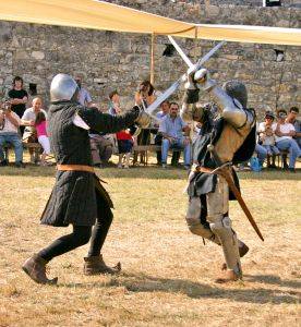 Knights engaged in a sword fight