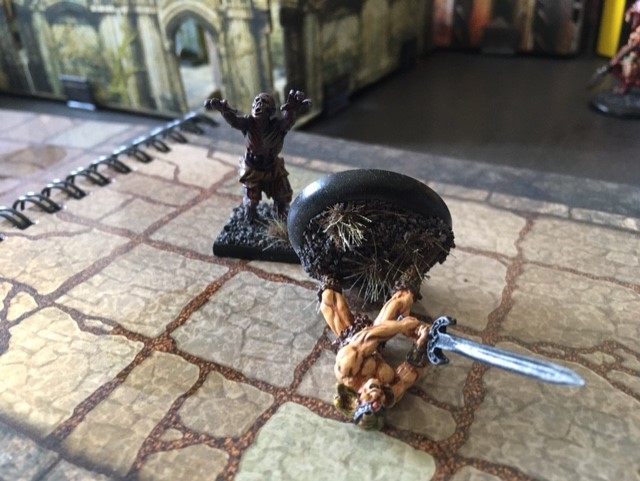 Two miniatures, one defeated